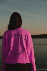 SUDADERA ROSA FLÚOR TACHAS NEGRA