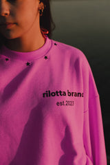 SUDADERA ROSA FLÚOR TACHAS NEGRA